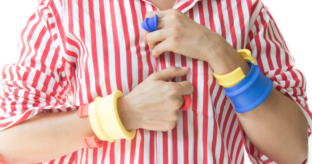 Lightweight architectural bracelets and rings worn on hand.
